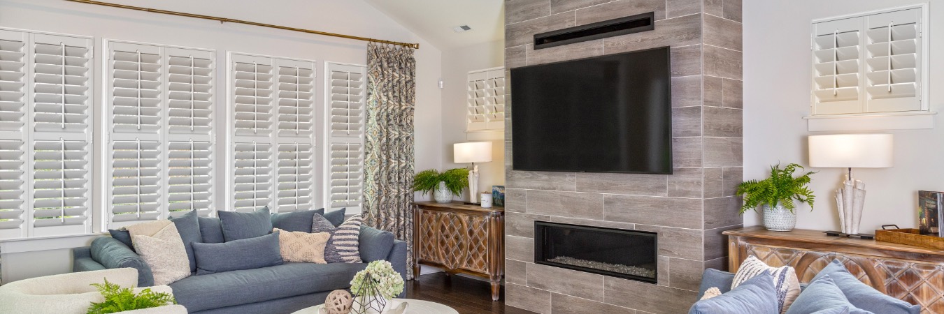 Plantation shutters in Marsing family room with fireplace