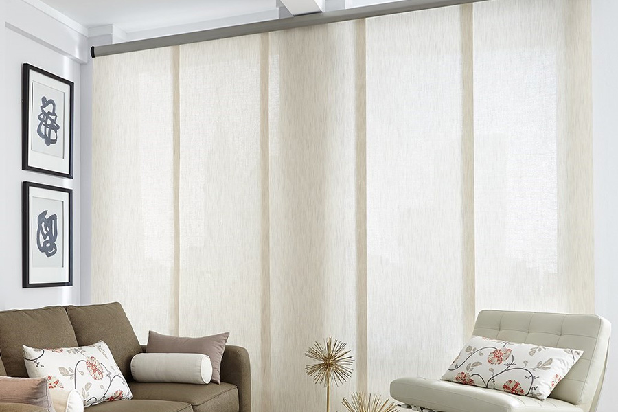  Long off-white window shades on a tall window in a modern living room